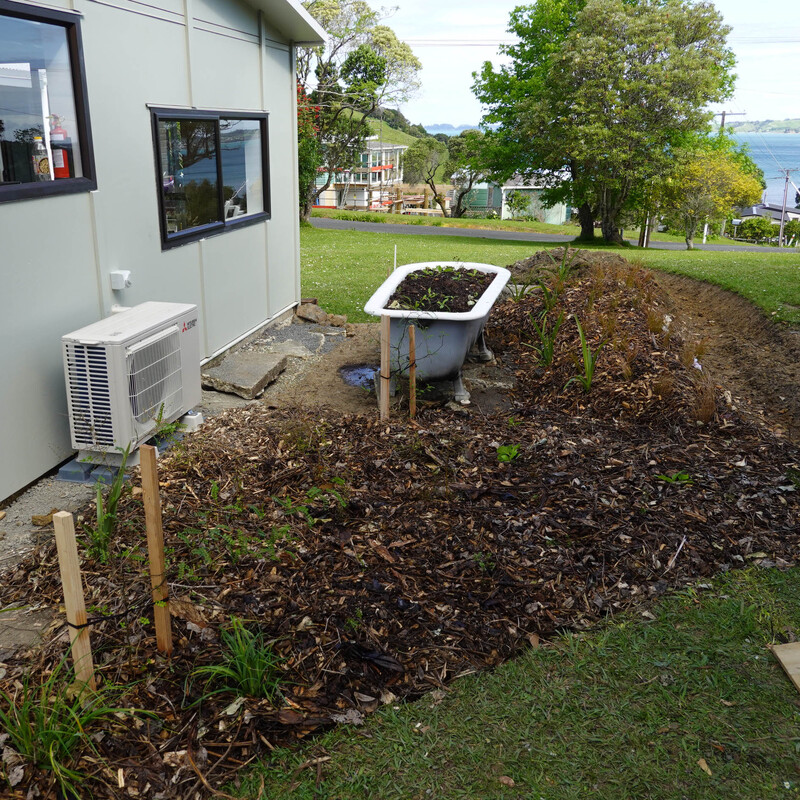 The old bath is repositioned outside the window so you can see the flowers